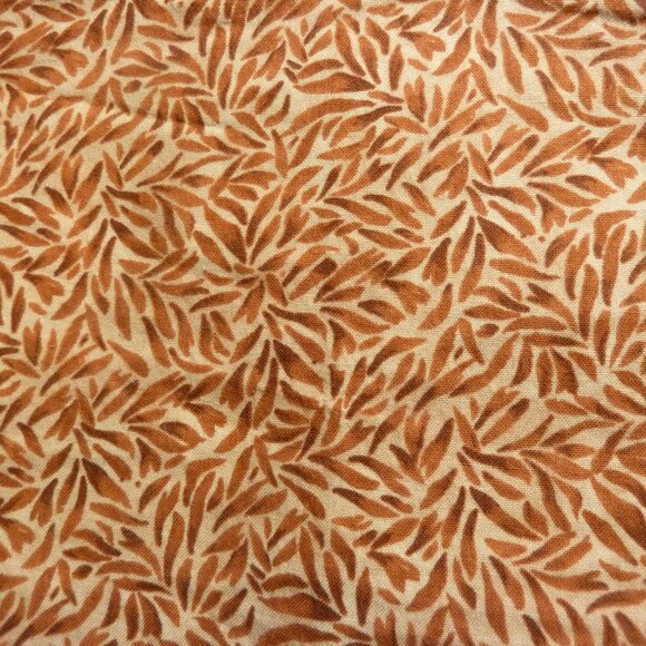 Fabric with abstract natural pattern in shades of orange, brown, and beige - Picture 1 of 3
